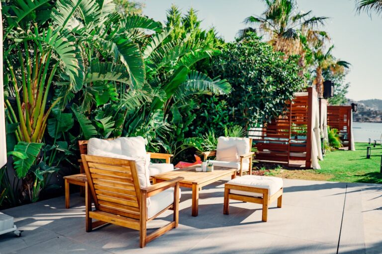 Wooden outdoor patio furniture on a backyard deck with a clean aesthetic look