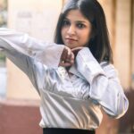 Woman posing outdoors with confidence in a natural candid setting