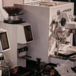 Espresso machine and coffee grinder on a clean kitchen counter