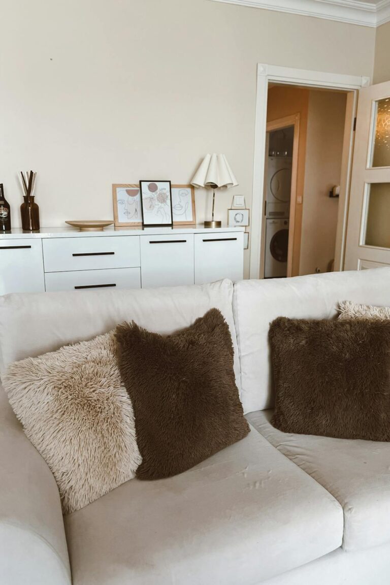 Minimalist neutral living room with clean lines and soft natural light
