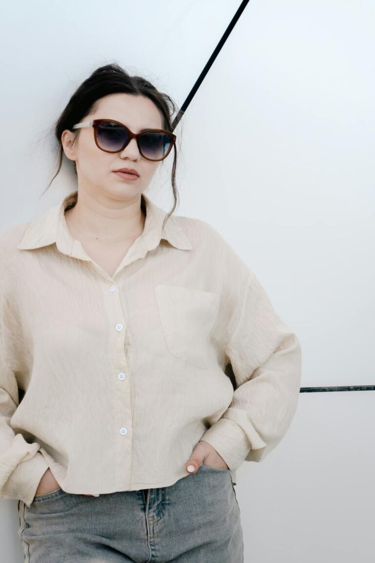 Woman in an elegant old money aesthetic outfit with tailored pieces and neutral tones