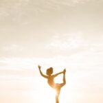 Woman posing for photos outdoors during golden hour light