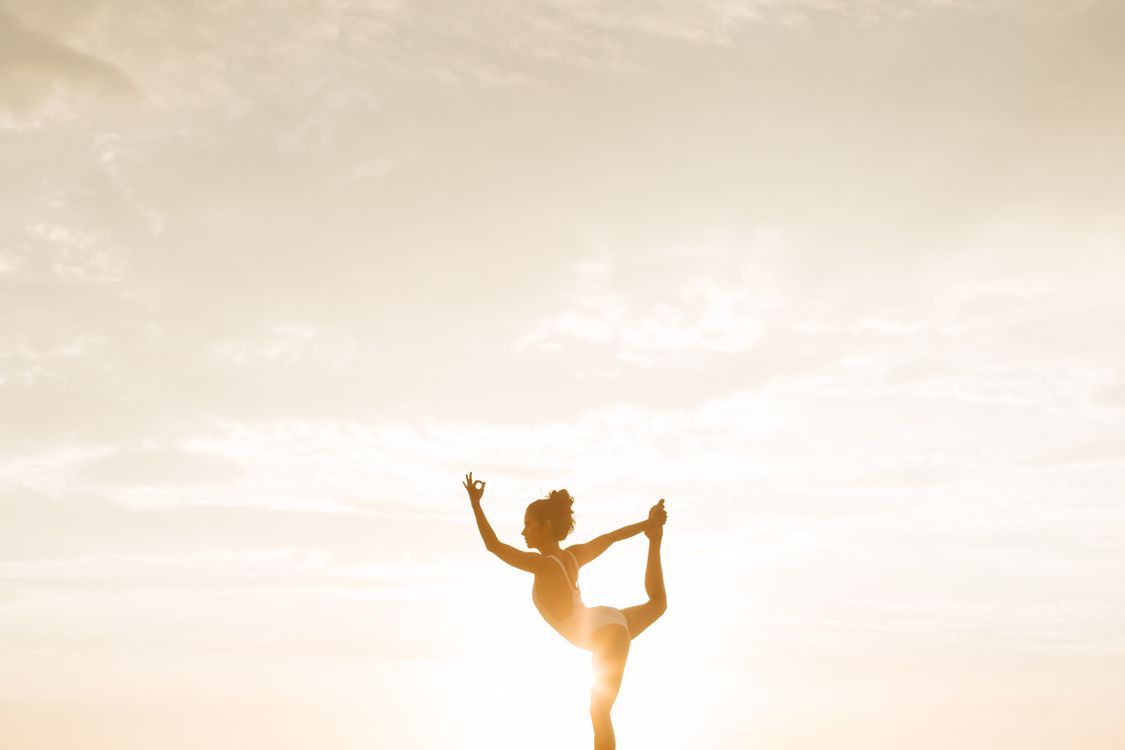 Woman posing for photos outdoors during golden hour light