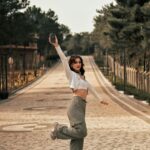 Woman posing outdoors at a scenic travel location