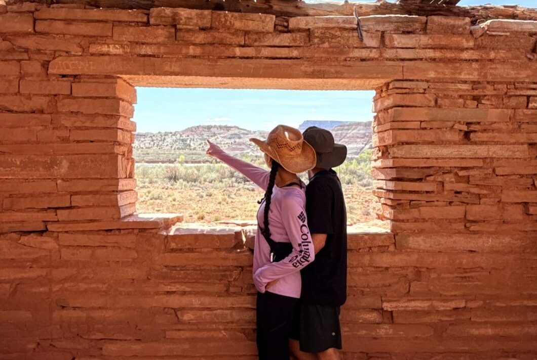 Mia and Dan, founders of Pic Inspo, exploring desert ruins on a hike
